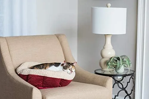 The non-skid bottom of the Petmate Aspen Pet Self Warming Round Bed ensures stability on smooth floors.