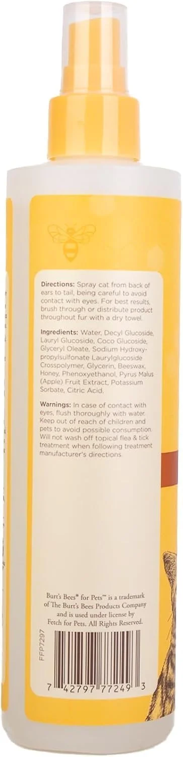 Applying waterless cat shampoo to a cat's coat