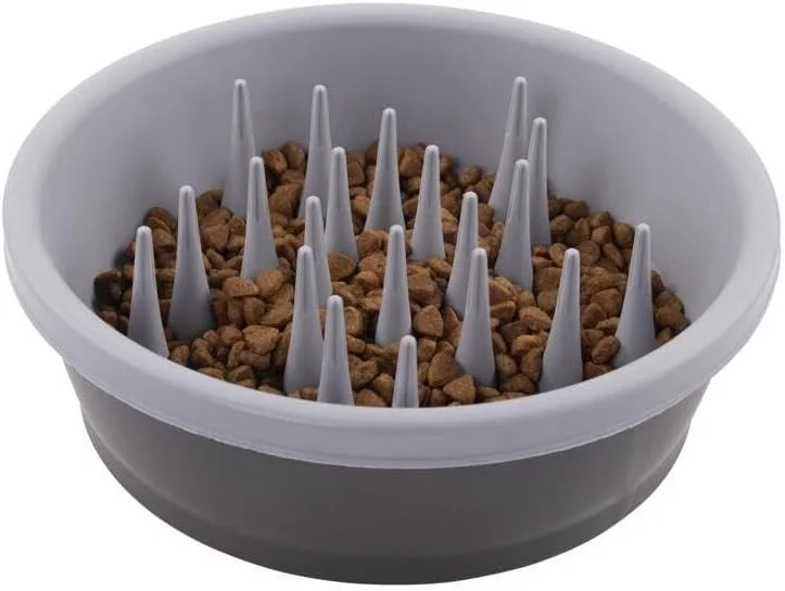 Dog eating slowly from a gray Dexas slow feeder bowl