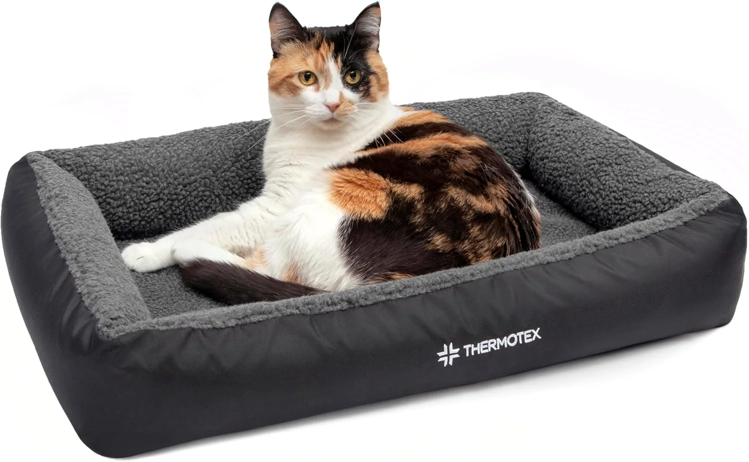 Senior dog sleeping comfortably on a therapeutic infrared heated bed